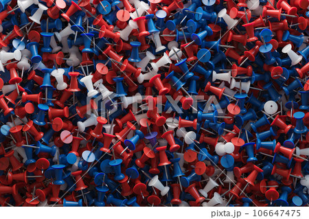 several assorted colors of plastic push pins 106647475