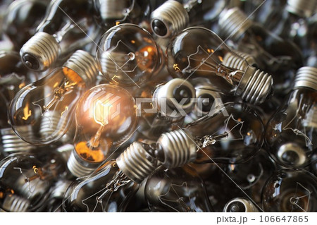 Heap of used old fashioned light bulbs Heap of used old fashioned light bulbs 106647865