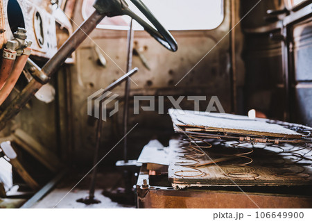 Rusted out springs and interior of an old truck  106649900