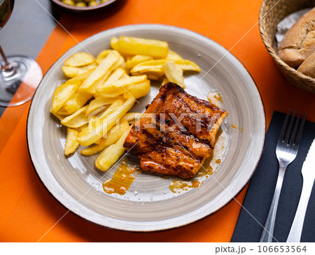 Spanish Secreto de cerdo - roasted pork served with potatoes Spanish Secreto de cerdo - roasted pork served with potatoes 106653564