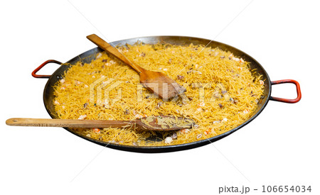 Cooking the Valencian dish Fideua de Marisco Cooking the Valencian dish Fideua de Marisco 106654034