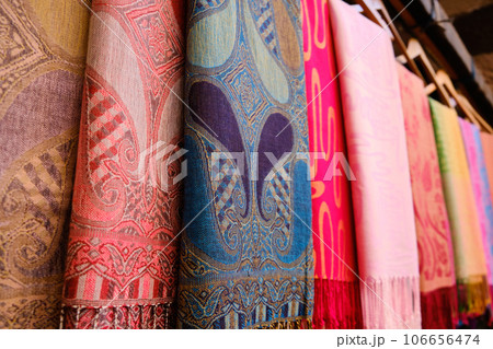 Traditional middle eastern shawls hanging at bazaar 106656474