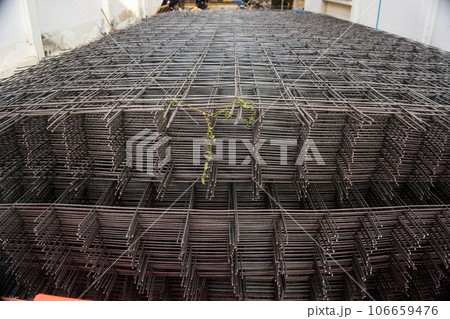 Bundle of wiremesh metal floor lean construction site building 106659476