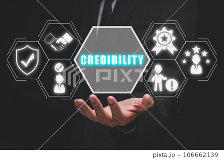Corporate credibility improvement concept, Business person hand holding credibility icon on virtual screen. 106662139