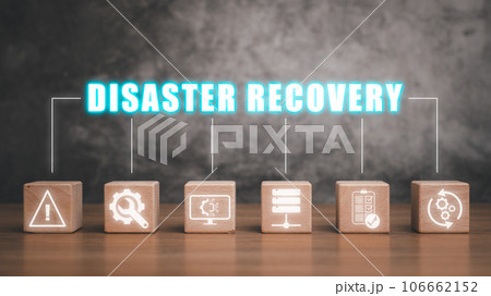 Disaster Recovery concept, Wooden block on desk with disaster recovery icon on virtual screen background, Data loss prevention. Disaster Recovery concept, Wooden block on desk with disaster recovery icon on virtual screen background, Data loss prevention. 106662152