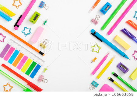 Creative layout made of neon colorful stationery set on white background. Space for your text Creative layout made of neon colorful stationery set on white background. Space for your text 106663659