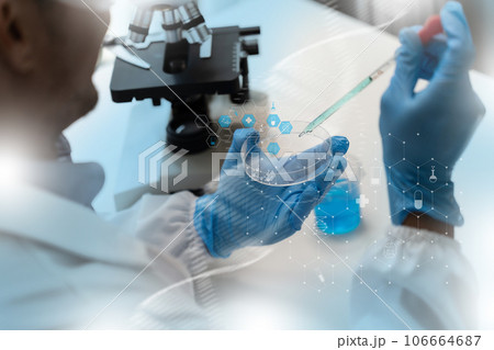 Man doctor biochemical research DNA scientist working with microscopical research in a lab Analysis of Biotechnology Specialist working with Advanced Equipment 106664687