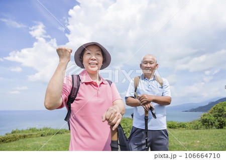 Happy Senior couple hiking together mountain coast Happy Senior couple hiking together mountain coast 106664710
