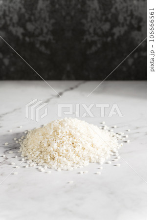 Rice on a marble slab under the sunlight. Rice on a marble slab under the sunlight. 106666561