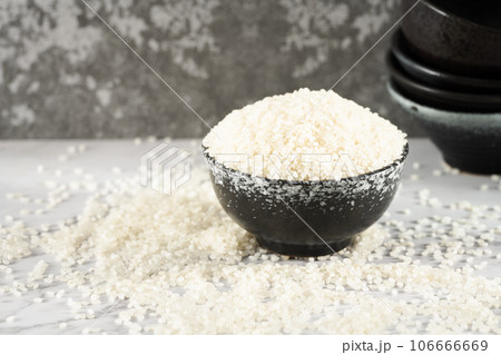 Rice in a bowl, illuminated by sunlight. Rice in a bowl, illuminated by sunlight. 106666669