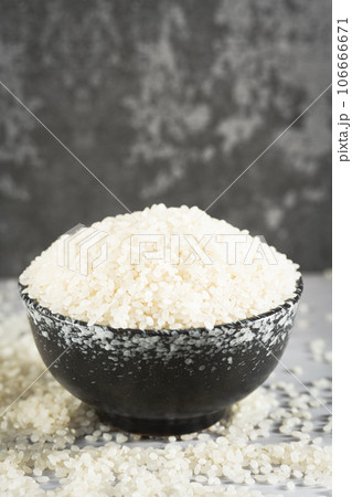 Rice in a bowl, illuminated by sunlight. Rice in a bowl, illuminated by sunlight. 106666671