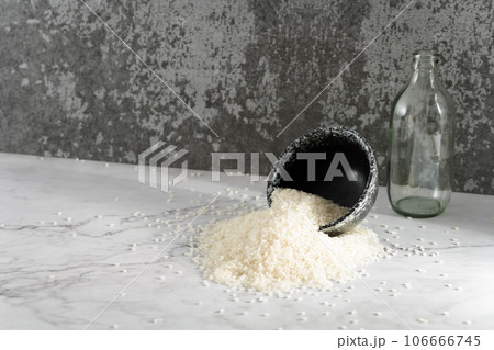 Rice in a bowl, illuminated by sunlight. Rice in a bowl, illuminated by sunlight. 106666745