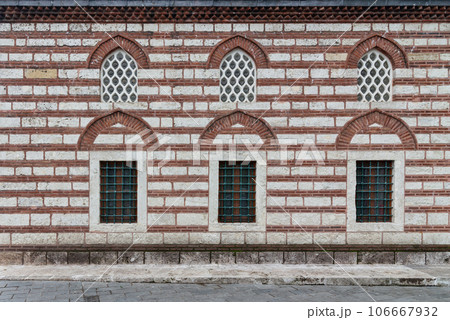 Red brick wall of 16th century Selman Aga Mosque in Uskudar, Istanbul, Turkey, with arched windows Red brick wall of 16th century Selman Aga Mosque in Uskudar, Istanbul, Turkey, with arched windows 106667932