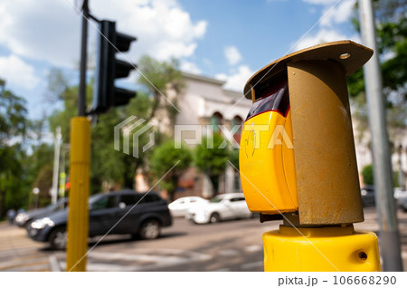 Close-up of a button for switching a pedestrian traffic light. Close-up of a button for switching a pedestrian traffic light. 106668290