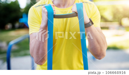 Working out with resistance rubber bands 106668916