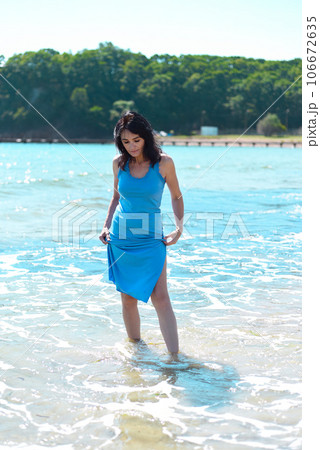45 years old Russian woman  standing in Japanese sea and looking away 106672635