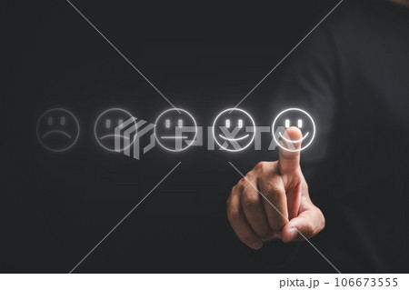 Close up of a finger man's hand touching provide positive feedback for excellent service. Concept of business satisfaction survey and digital technology, smile face for good service Close up of a finger man's hand touching provide positive feedback for excellent service. Concept of business satisfaction survey and digital technology, smile face for good service 106673555