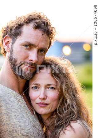 Summertime Serenity: Adorable Millennial Couple in Garden 106674099