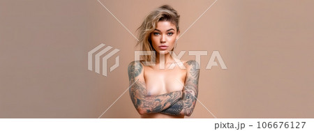 portrait of a young attractive tattooed woman, banner 106676127