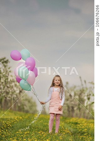 girl with colorful balloons girl with colorful balloons 106676266