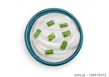 sour cream or yogurt in ceramic bowl isolated on white background with full depth of field. Top view. Flat lay sour cream or yogurt in ceramic bowl isolated on white background with full depth of field. Top view. Flat lay 106676935