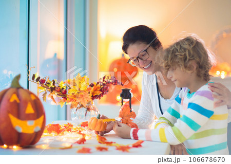 Family decorating home. Halloween arts and crafts. Family decorating home. Halloween arts and crafts. 106678670