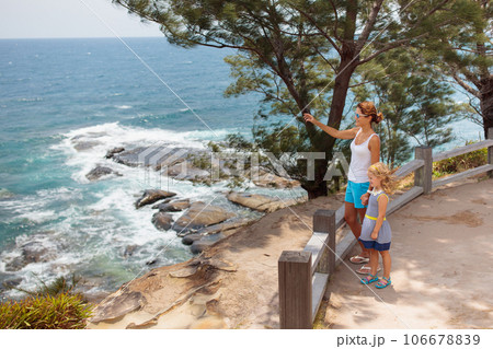 Family hiking. Mountain sea view. Travel with kids Family hiking. Mountain sea view. Travel with kids 106678839