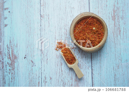 chili flakes in a bowl on table chili flakes in a bowl on table 106681788