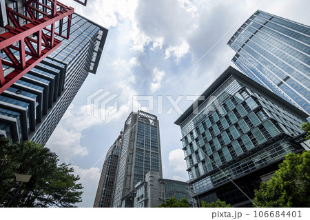 Low angle view of the plaza in Xinyi Business District, Taipei, Taiwan. the District is Taipei's main shopping area, anchored by various department stores and malls. Low angle view of the plaza in Xinyi Business District, Taipei, Taiwan. the District is Taipei's main shopping area, anchored by various department stores and malls. 106684401