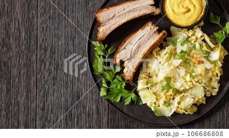 Haluski, fried cabbage, noodles with roast ribs Haluski, fried cabbage, noodles with roast ribs 106686808