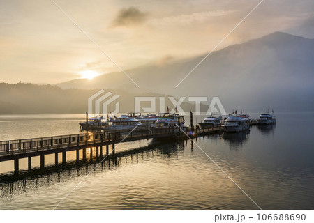 Sunrise view of yacht Marina in Sun Moon Lake, Nantou, Taiwan. it's a famous attraction in Taiwan. Sunrise view of yacht Marina in Sun Moon Lake, Nantou, Taiwan. it's a famous attraction in Taiwan. 106688690