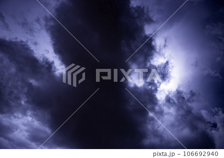 Ray. Storm. The sky is full of dark clouds in bad weather before a big storm rain. Light emission from the Edge of clouds. Zoom the surface of a Black haze at close range. Ray. Storm. The sky is full of dark clouds in bad weather before a big storm rain. Light emission from the Edge of clouds. Zoom the surface of a Black haze at close range. 106692940