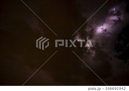 Ray. Storm. The sky is full of dark clouds in bad weather before a big storm rain. Light emission from the Edge of clouds. Zoom the surface of a Black haze at close range. Ray. Storm. The sky is full of dark clouds in bad weather before a big storm rain. Light emission from the Edge of clouds. Zoom the surface of a Black haze at close range. 106692942