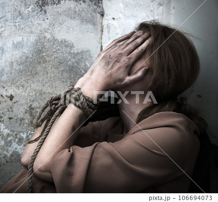 The bound prisoner sit on the floor The bound prisoner sit on the floor 106694073