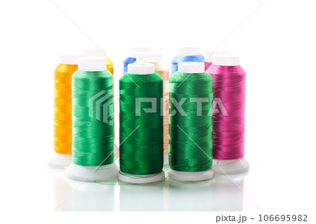 set of different color sewing threads,on white background. 106695982