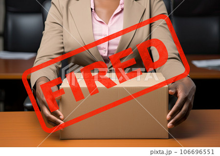 Сoncept of dismissal from work. Сlose-up cardboard box on a table 106696551