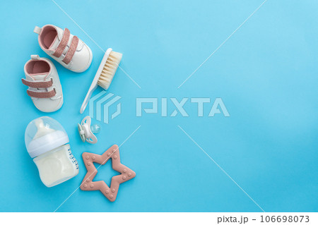 Laying out baby necessities: an aerial view on blue Laying out baby necessities: an aerial view on blue 106698073