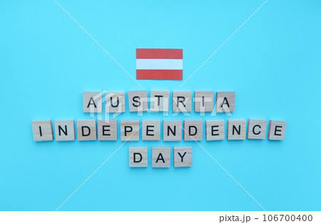 October 26, Austrian independence Day, flag of Austria, minimalistic banner with the inscription in wooden letters 106700400