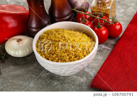 Dry wheat bulgur cereal heap 106700791