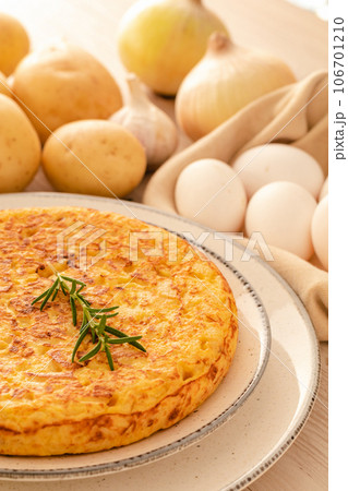 Spanish omelette with potatoes and onion, typical Spanish cuisine. Tortilla espanola Spanish omelette with potatoes and onion, typical Spanish cuisine. Tortilla espanola 106701210