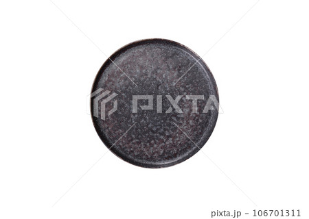 Black plate on a black background. Flat lay, top view, copy space Black plate on a black background. Flat lay, top view, copy space 106701311