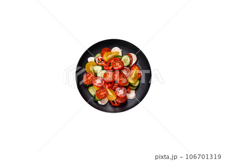 Fresh, delicious salad with cherry tomatoes, cucumbers, sweet peppers, cheese and olive oil Fresh, delicious salad with cherry tomatoes, cucumbers, sweet peppers, cheese and olive oil 106701319
