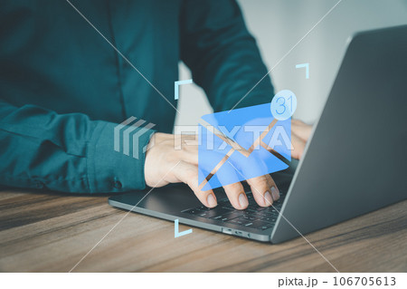 Man hand using computer laptop typing on keyboard and surfing the internet on office table with email icon. Concept of Email marketing, send e-mail or news letter, online working internet network.. Man hand using computer laptop typing on keyboard and surfing the internet on office table with email icon. Concept of Email marketing, send e-mail or news letter, online working internet network.. 106705613