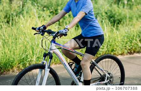 Riding bike in spring forest 106707388