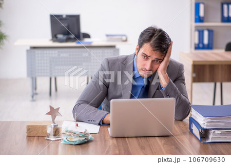 Young male employee working in the office 106709630