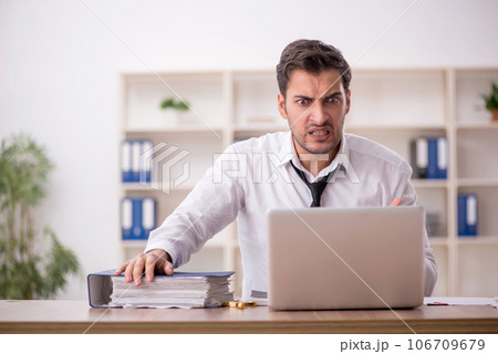 Young male employee working in the office 106709679