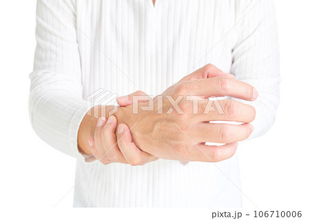 Hand of woman she massages his thumb and has finger pain, locked finger from work and office syndrome. on a white background medical concept 106710006