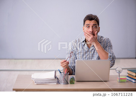 Young male student in tele-education concept 106711228