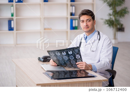 Young male doctor radiologist working in the clinic Young male doctor radiologist working in the clinic 106712400