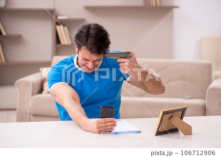 Young man in unhappy love concept 106712906